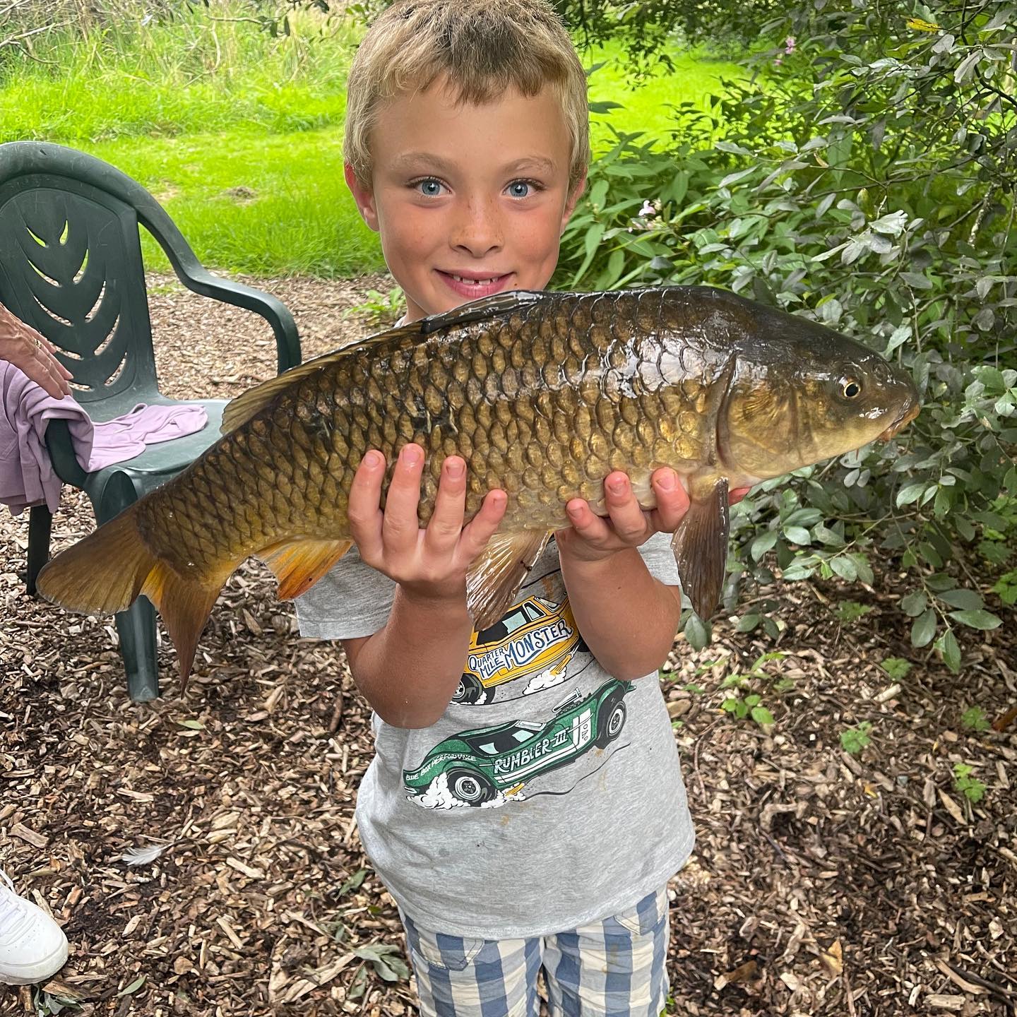 Child who has caught a carp